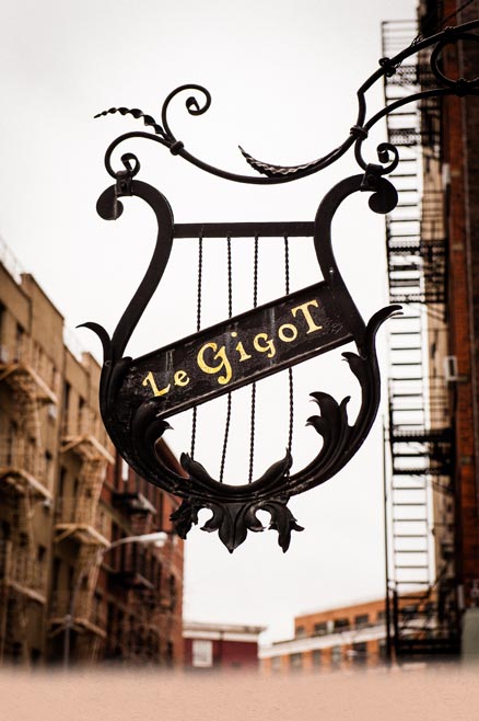 Photograph of the Le Gigot sign on the wall outside the building